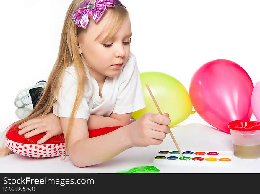 Adorable little girl drawing artwork. Studio shot