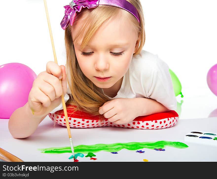 Adorable little girl drawing artwork. Studio shot