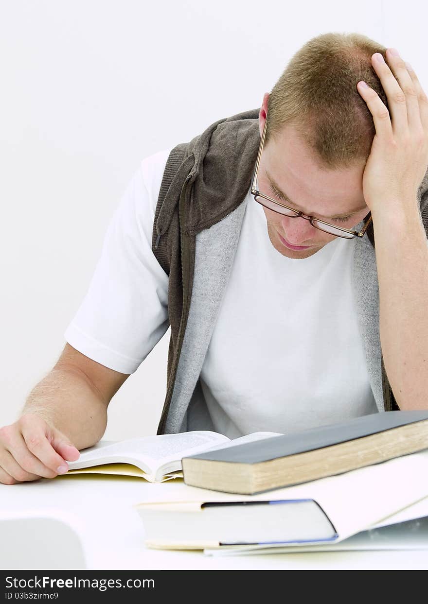 A young student working on his homework. A young student working on his homework