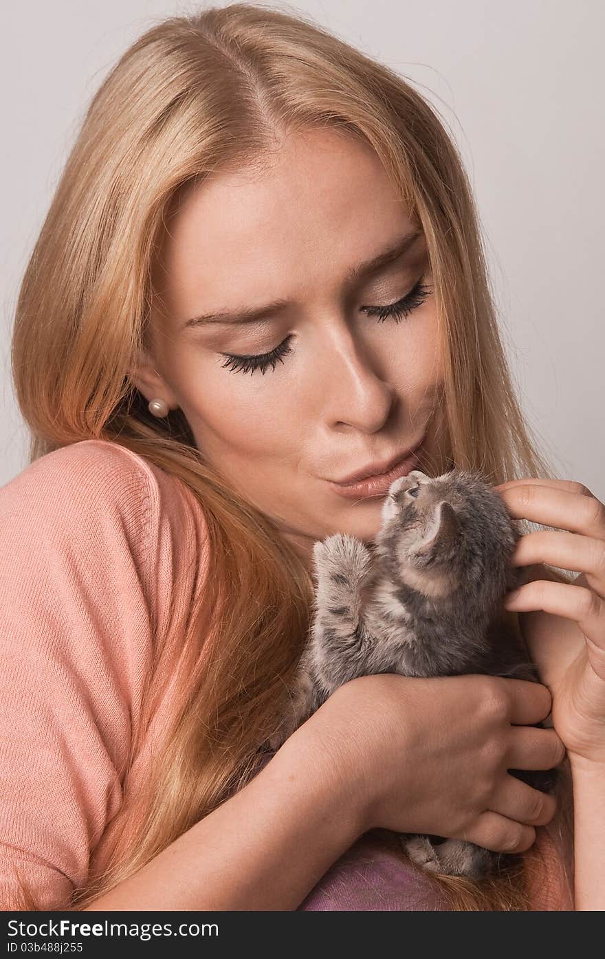 Blond and kitten closeup