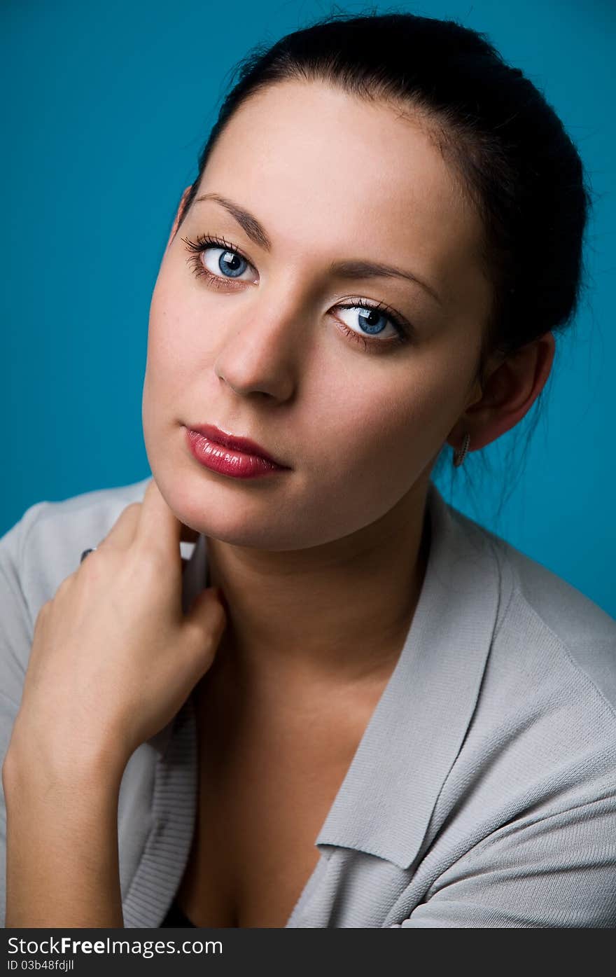 The woman on a dark blue background close up