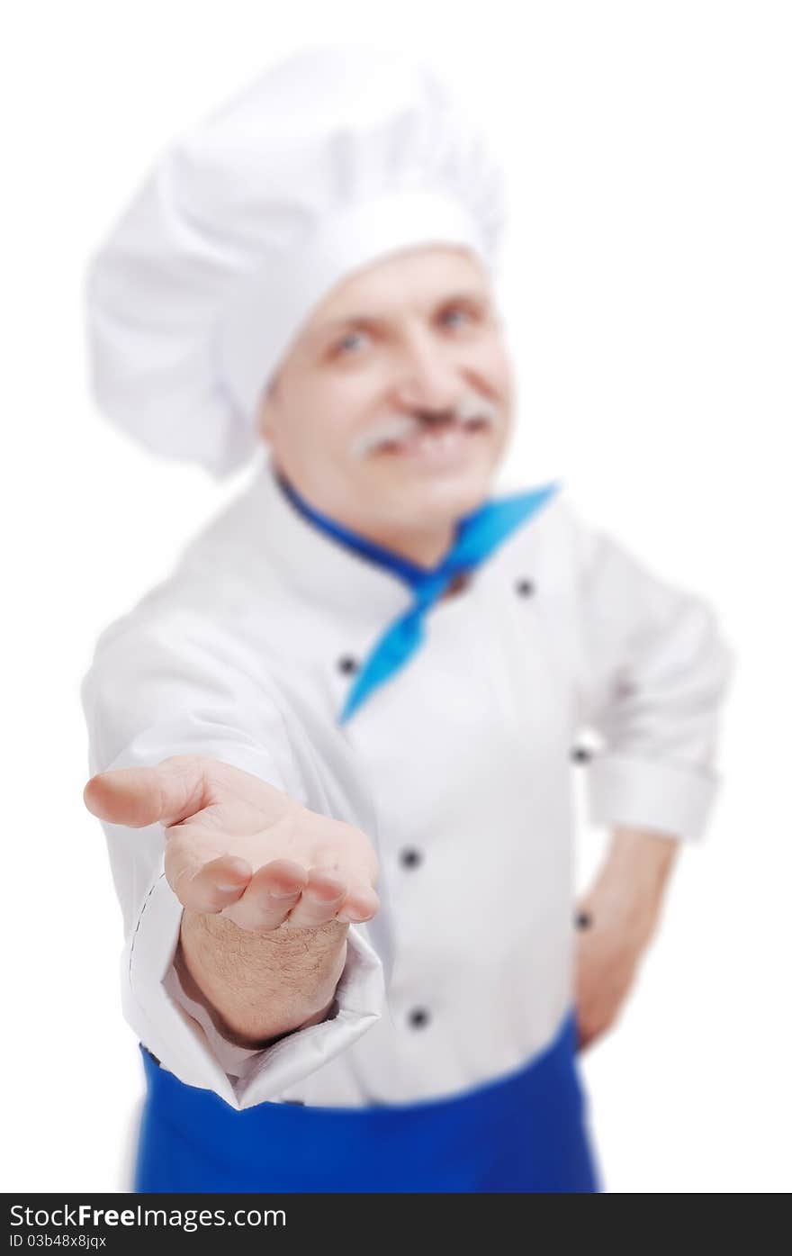 Senior chef in white uniform making a gesture with his hand. Senior chef in white uniform making a gesture with his hand