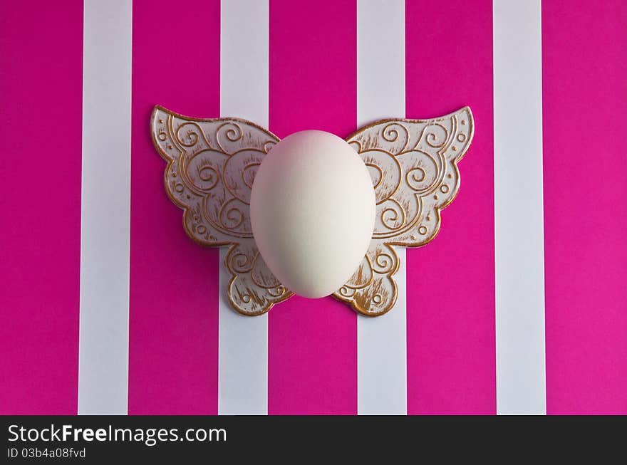 easter egg on a striped background