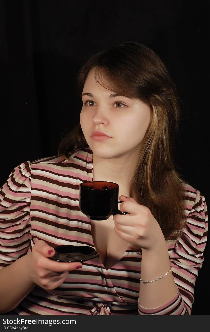 Beautiful teen girl with coffee cup