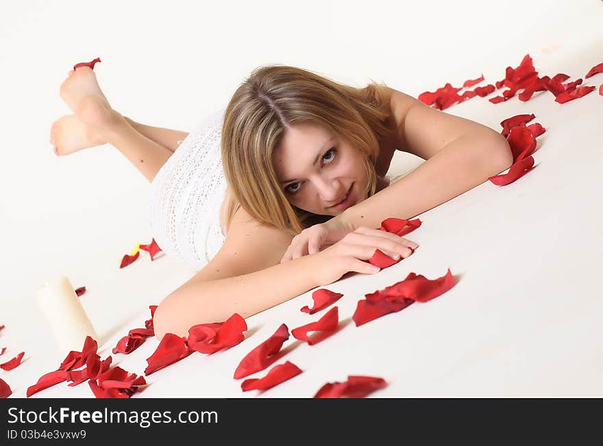 A Girl Lieing Among Rose Petals