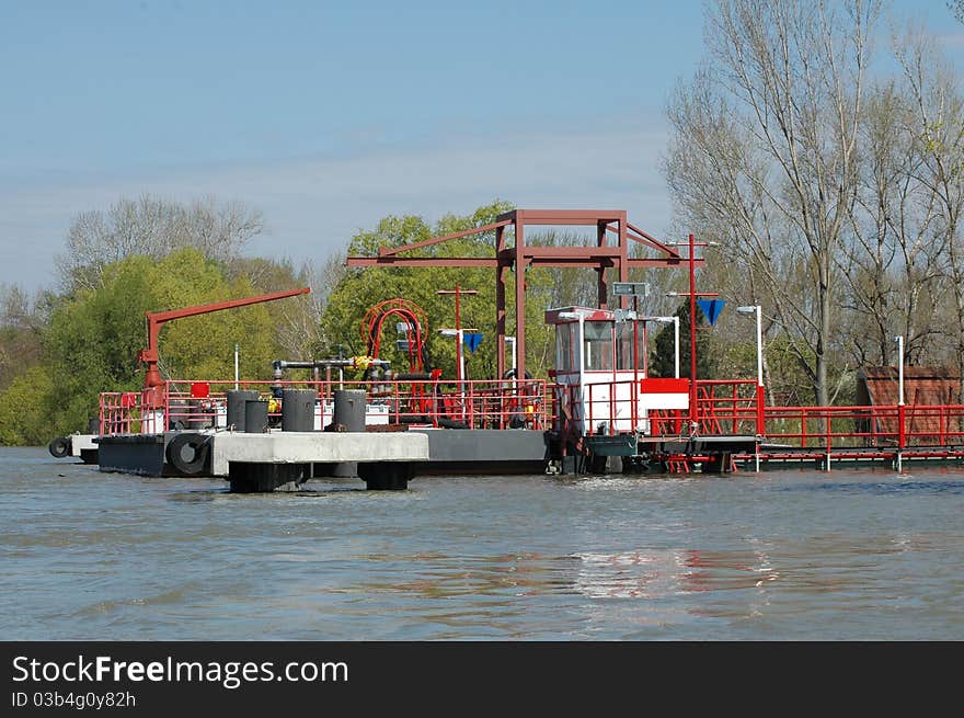 River dock while unloading oil. River dock while unloading oil