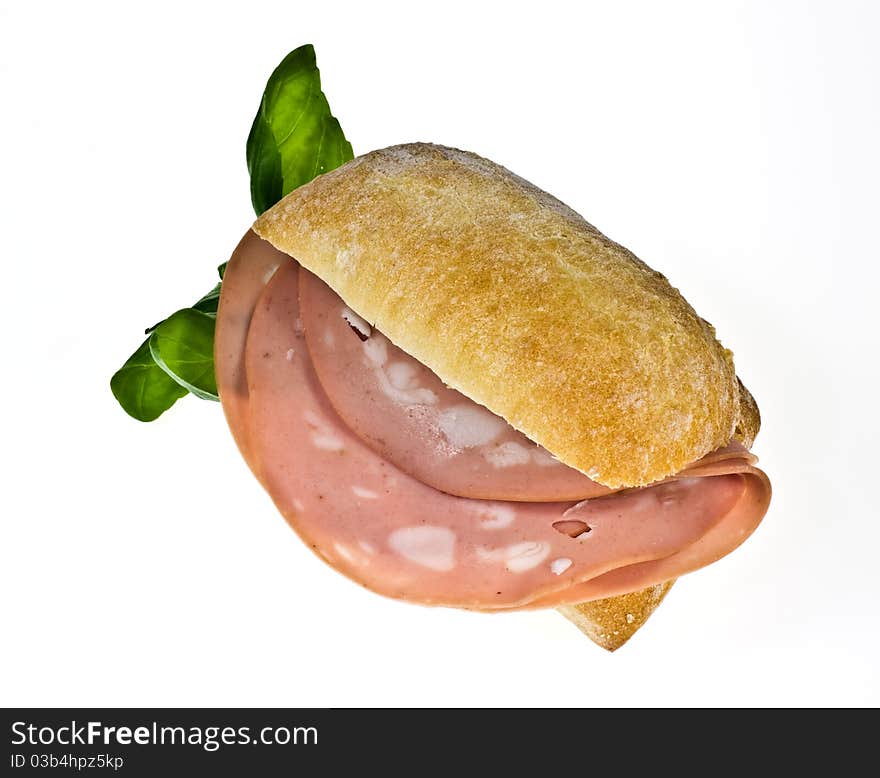 Ciabatta bread roll with mortadella and basil