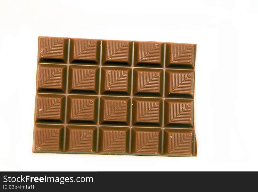 A piec of chocolate isolated on a white background