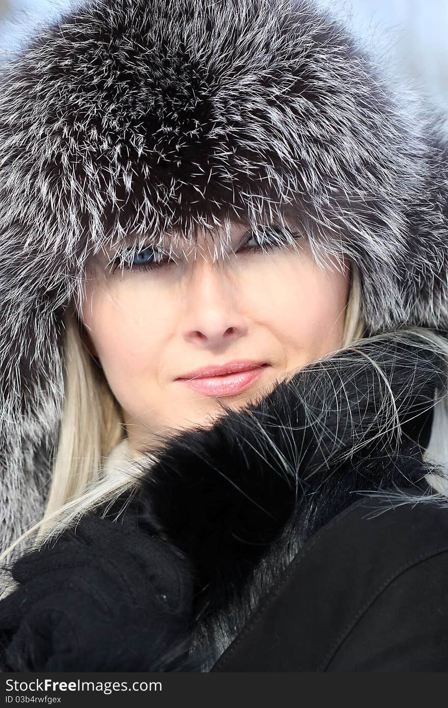 Beautiful woman in winter fur coat. Beautiful woman in winter fur coat