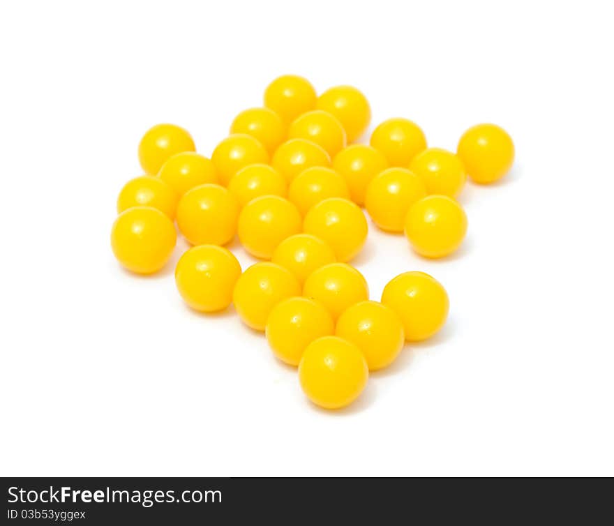 A pile of vitamin pills isolated on a white background