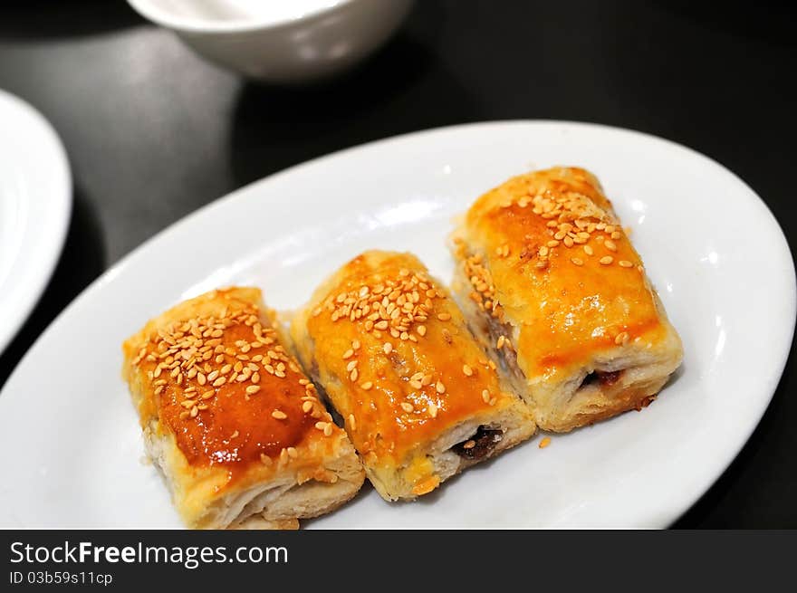 Freshly baked delicious pastry found in traditional Oriental high tea known as Dim Sum. Freshly baked delicious pastry found in traditional Oriental high tea known as Dim Sum.