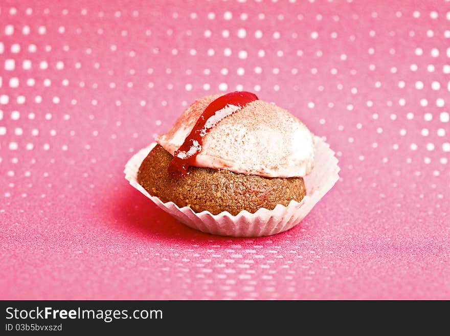 Beautiful little cake on colorful wallpaper background