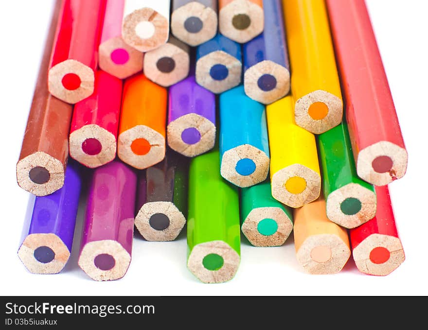 Colour pencils isolated on white background close up. Focus on the middle