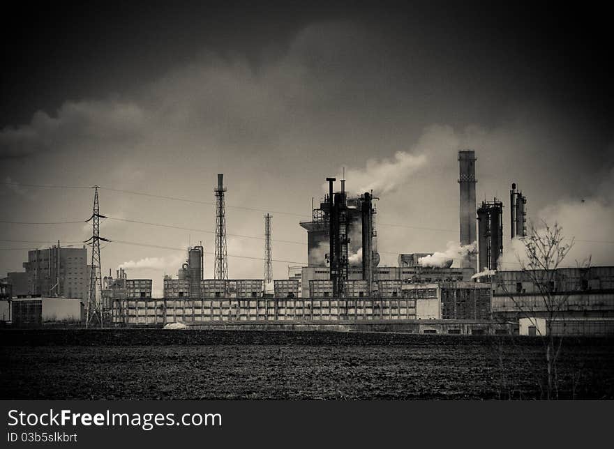 Smoke coming out of old factory chimney