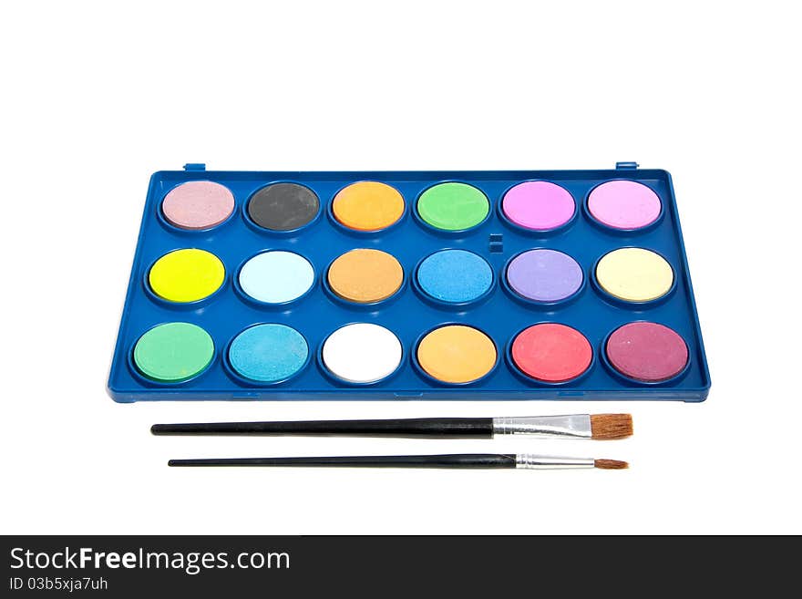 Water-color paint and brushes isolated over white background