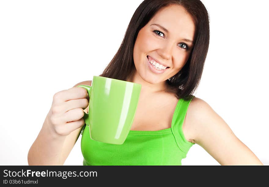 Pretty girl with a green cup on a white background