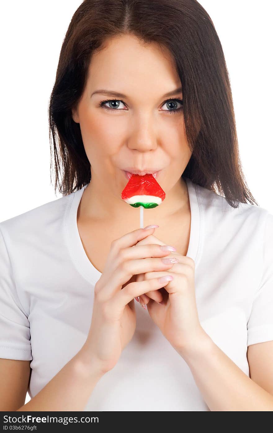 Pretty girl with candy on a white background