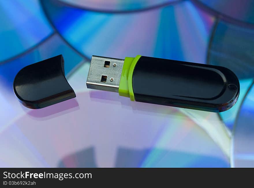 Pen Drive memory stick on a multimedia background.