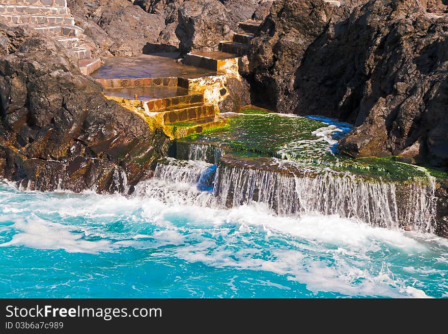 Turquoise water on stairs in Tenerife. Turquoise water on stairs in Tenerife