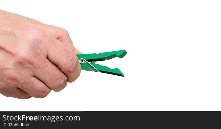 Hand with a green clothespins closeup on white background. Hand with a green clothespins closeup on white background