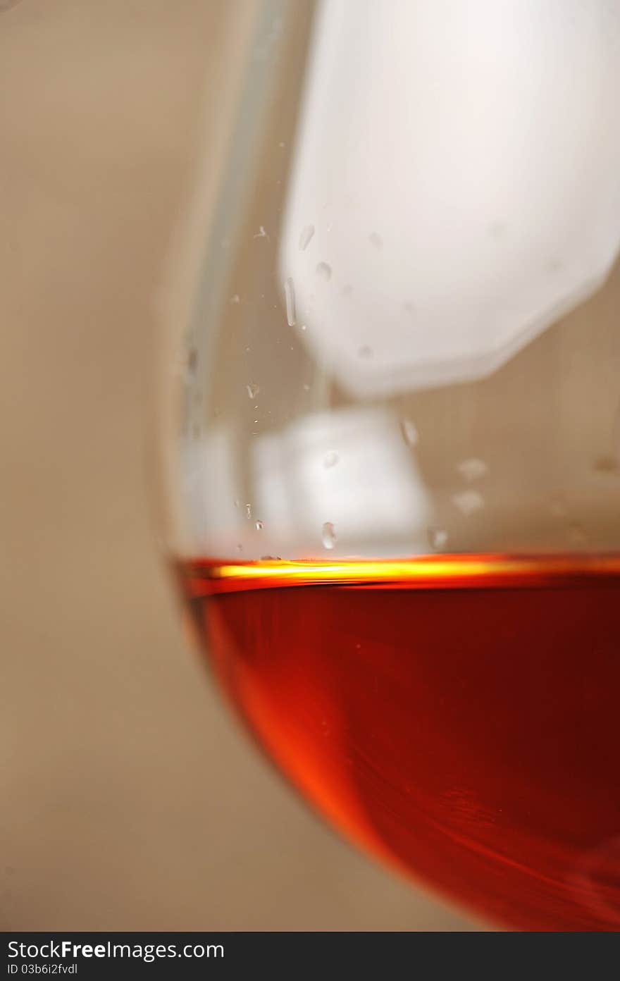 Snifter of brandy in elegant glass. black background. Snifter of brandy in elegant glass. black background