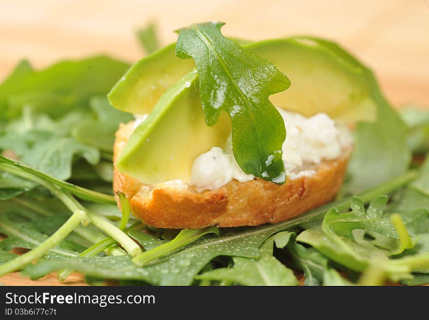 Delicious sandwich of toasted bread, avocado and spinach