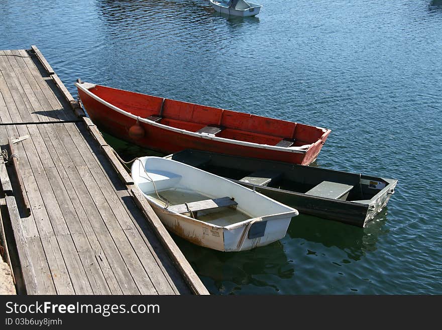 Skiffs are the small boats used in a fishing village or ports to get back and forth in shallow water to the large boats and ships anchored in deep water. Skiffs are the small boats used in a fishing village or ports to get back and forth in shallow water to the large boats and ships anchored in deep water.