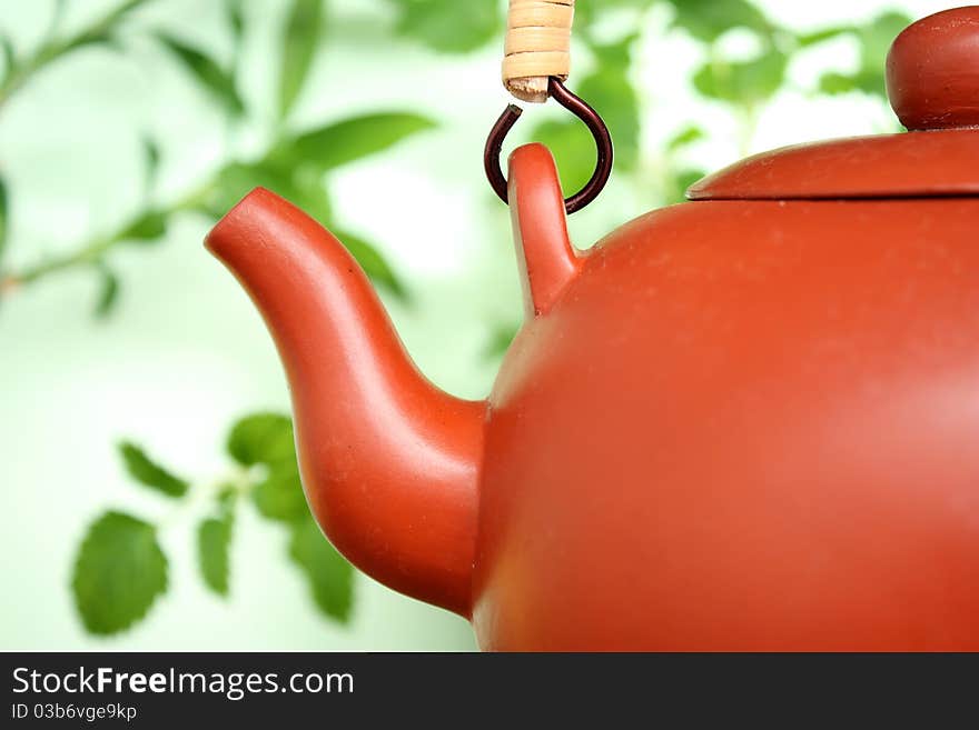 Ceramic teapot with leaves