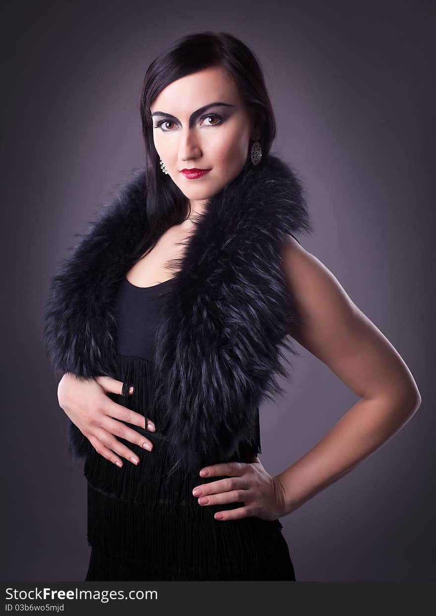 Woman in fur boa portrait - retro style make-up