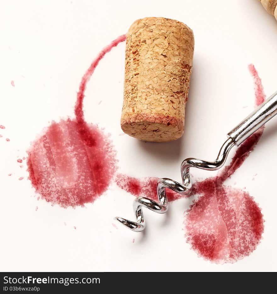 Wine circles from the bottle on old paper with a corkscrew and stoppers. Wine circles from the bottle on old paper with a corkscrew and stoppers.