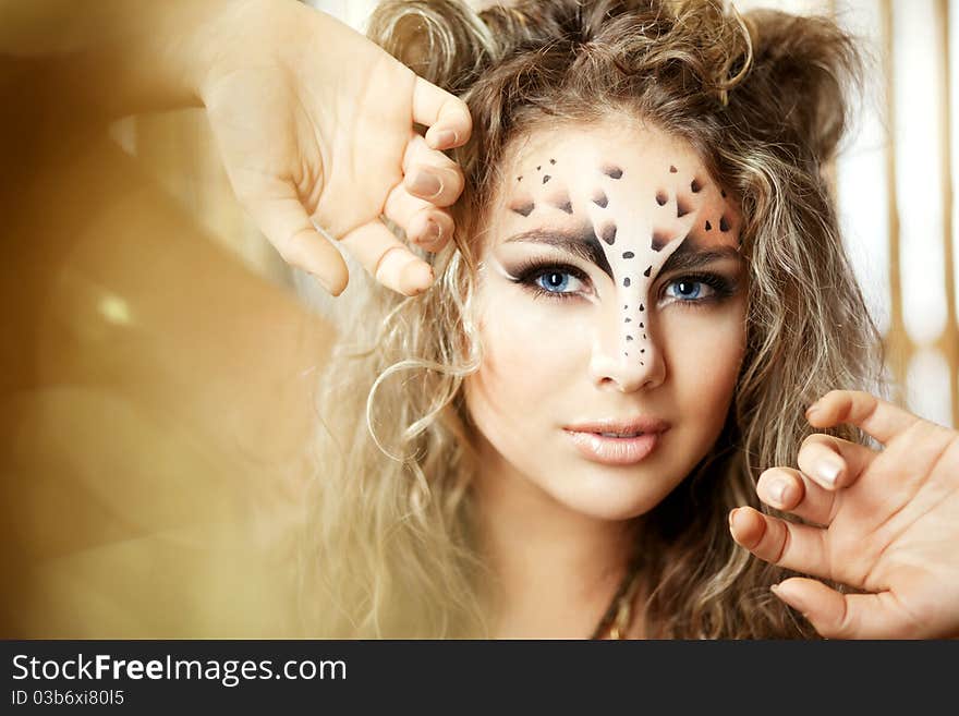 Girl With An Unusual Make-up As A Leopard