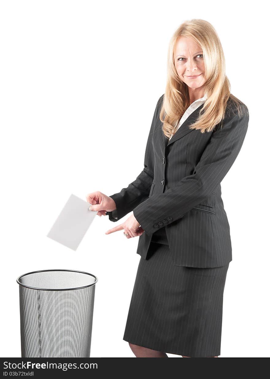 Middle aged woman casting a letter in the waste paper bin on isolated background. Middle aged woman casting a letter in the waste paper bin on isolated background