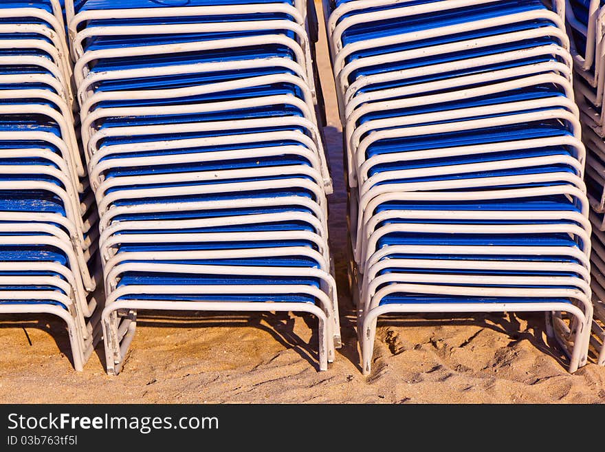 Stapled chairs at the beautiful beach. Stapled chairs at the beautiful beach