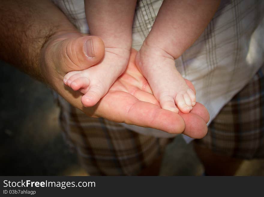 Father was holding this baby to show how small she is. Father was holding this baby to show how small she is.