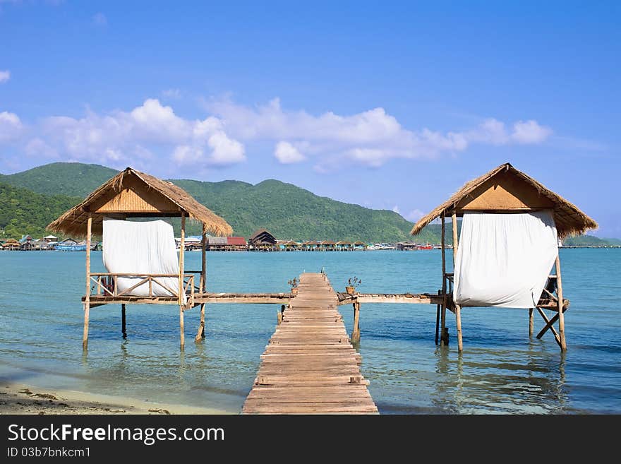 Wooden beach bungalows over water