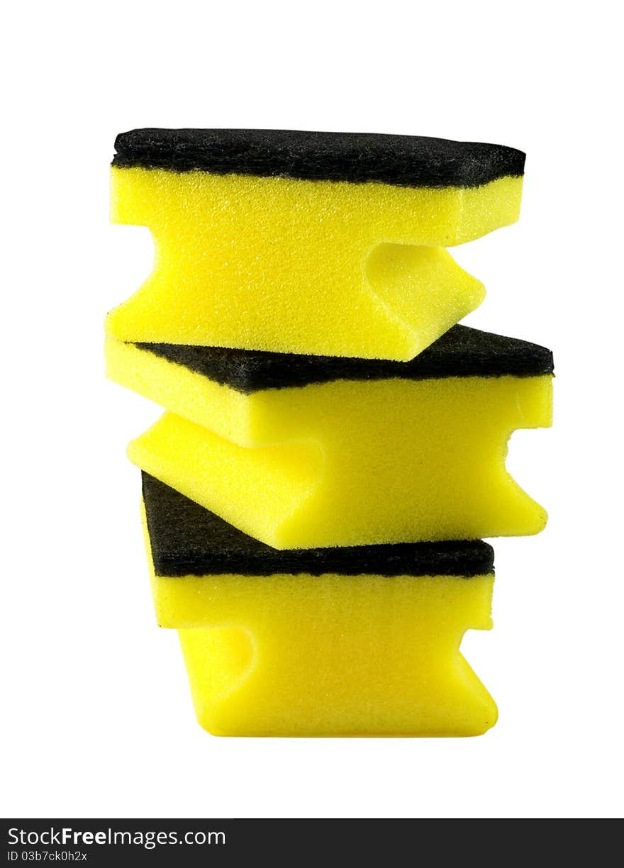 Three yellow cleaning sponges over white