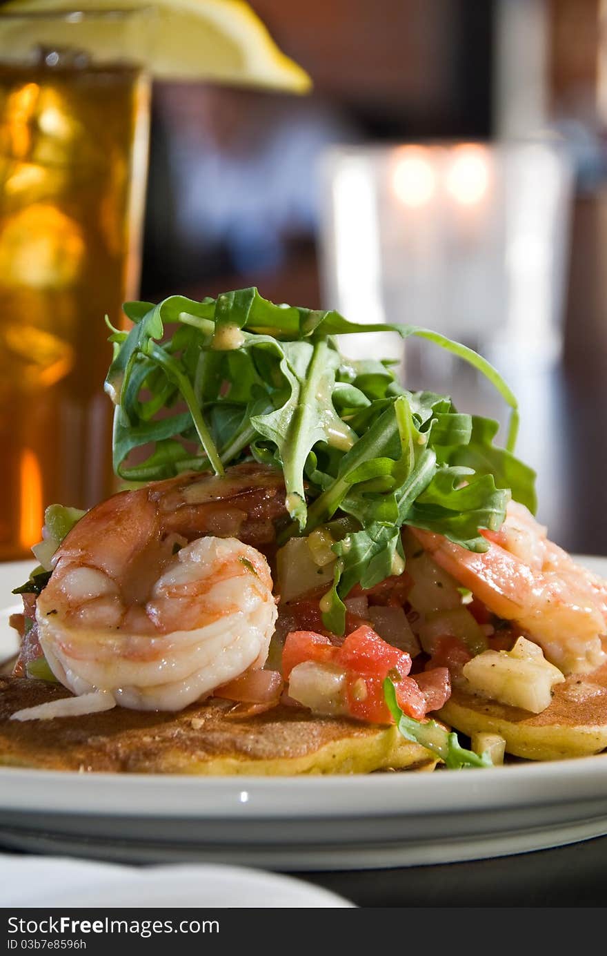 Pancakes with shrimp and arugula