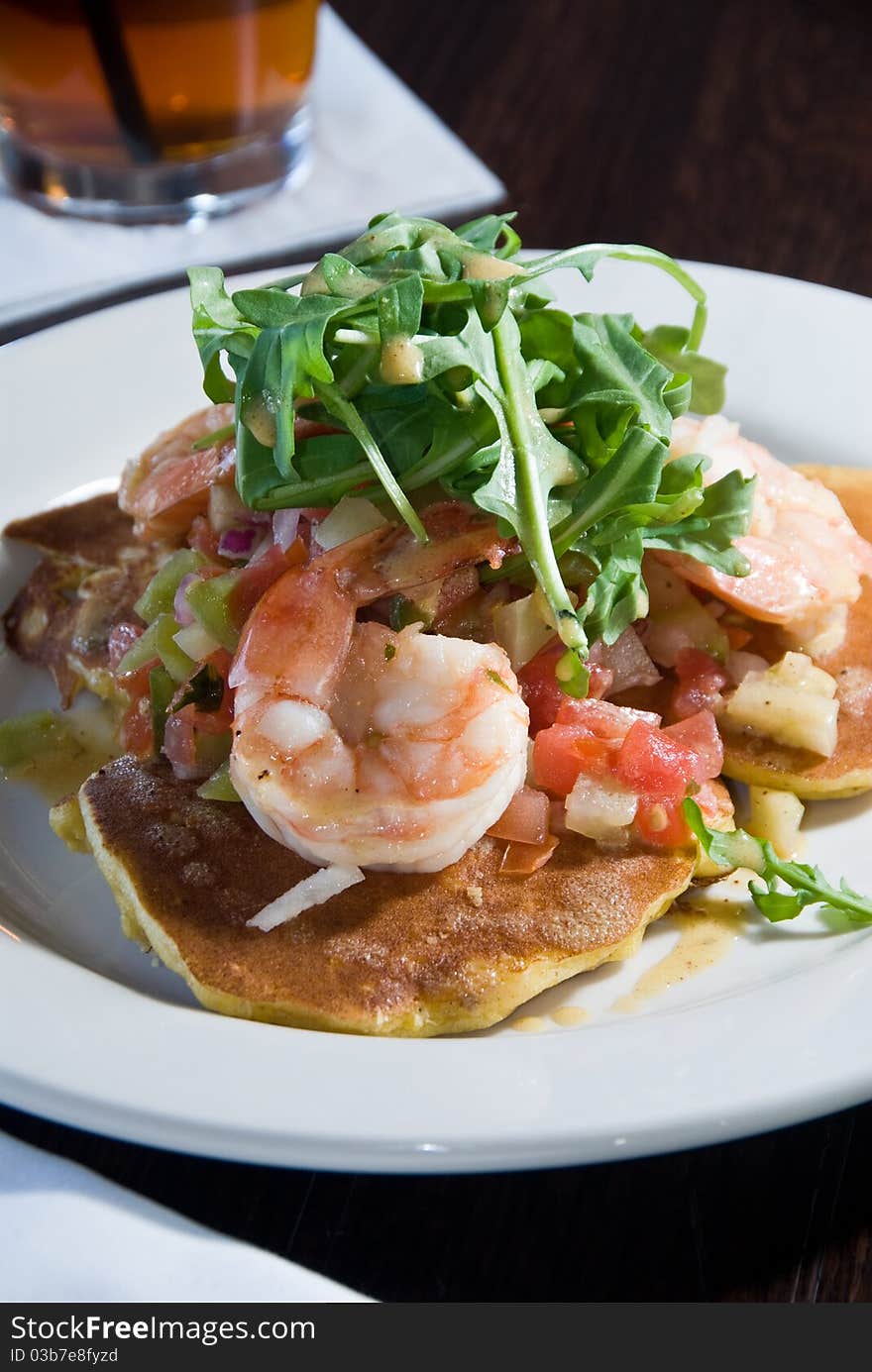 Pancakes with shrimp and arugula