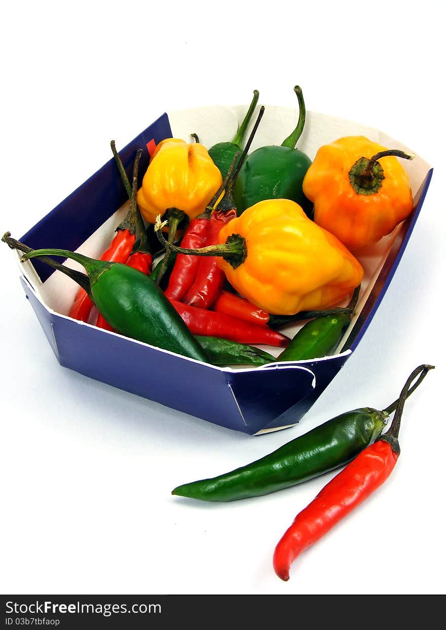 A selection of mixed chillies in a cardboard tray