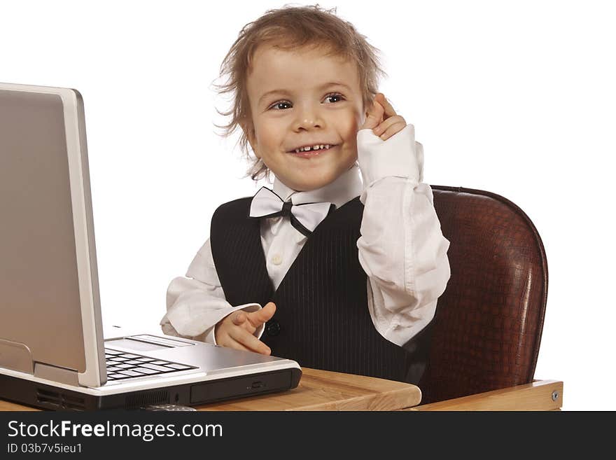 Little child and laptop. Isolated on white background