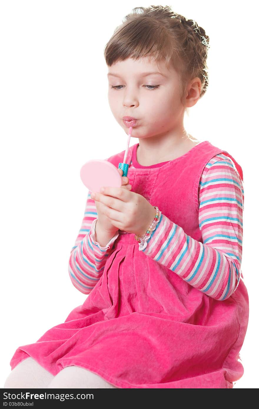 Young girl applies lipstick. Isolated on a white background. Young girl applies lipstick. Isolated on a white background.