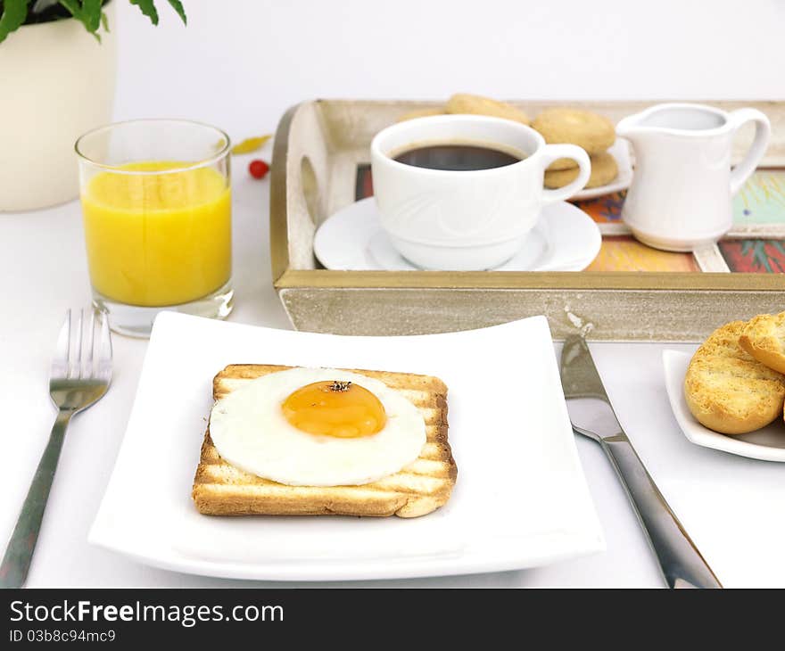 Breakfast set with fried egg on toast