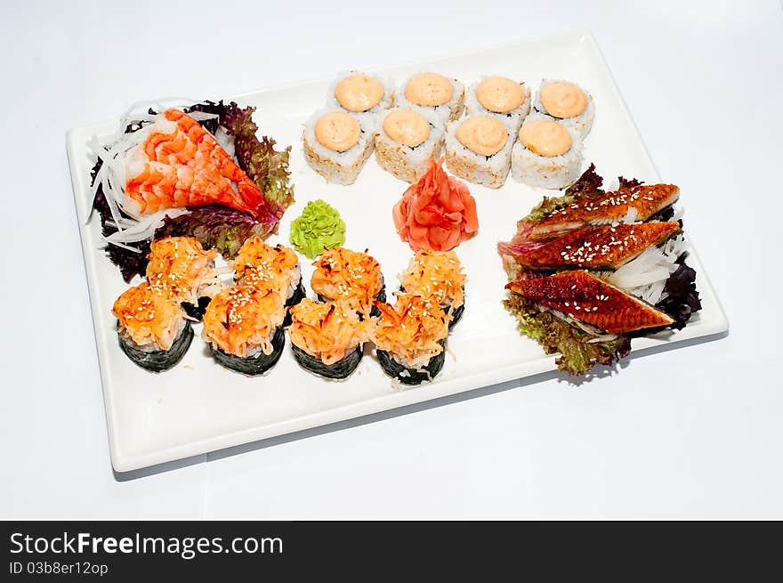 Plate with sushi and roll. Plate with sushi and roll