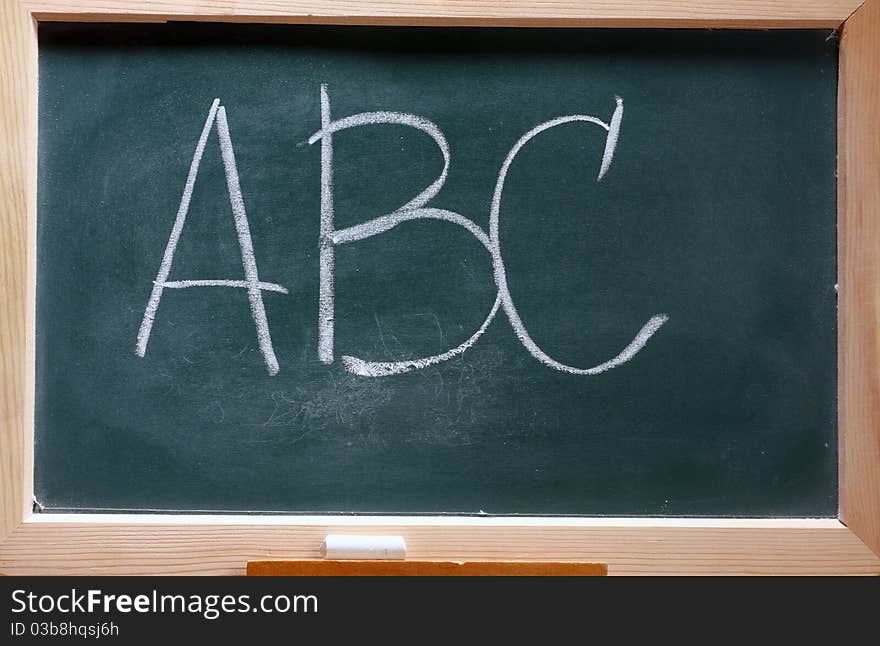 Isolated green blackboard close up