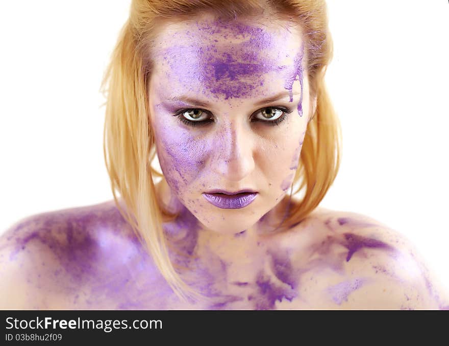 Concept studio portrait of a young woman smeared in purple ink isolated on white. Concept studio portrait of a young woman smeared in purple ink isolated on white