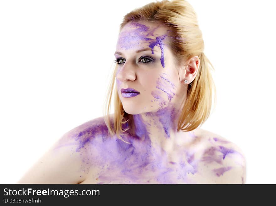 Concept studio portrait of a young woman smeared in purple ink isolated on white. Concept studio portrait of a young woman smeared in purple ink isolated on white