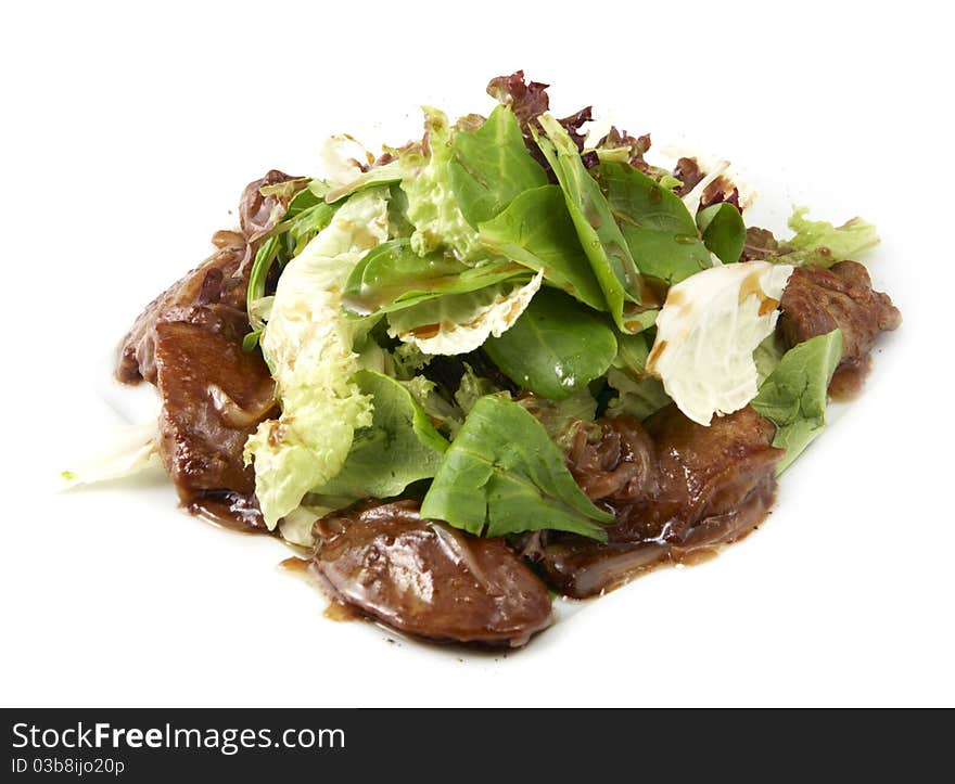 Studio photography of a salad with meat on white background