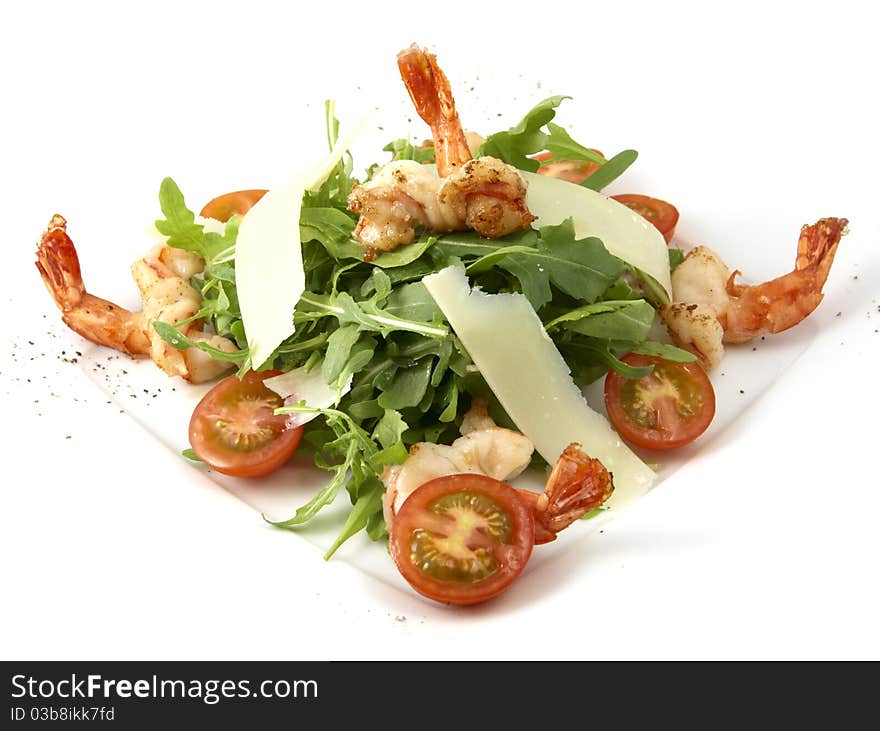 Studio photography of a Caesar salad with prawns and cheese on white background