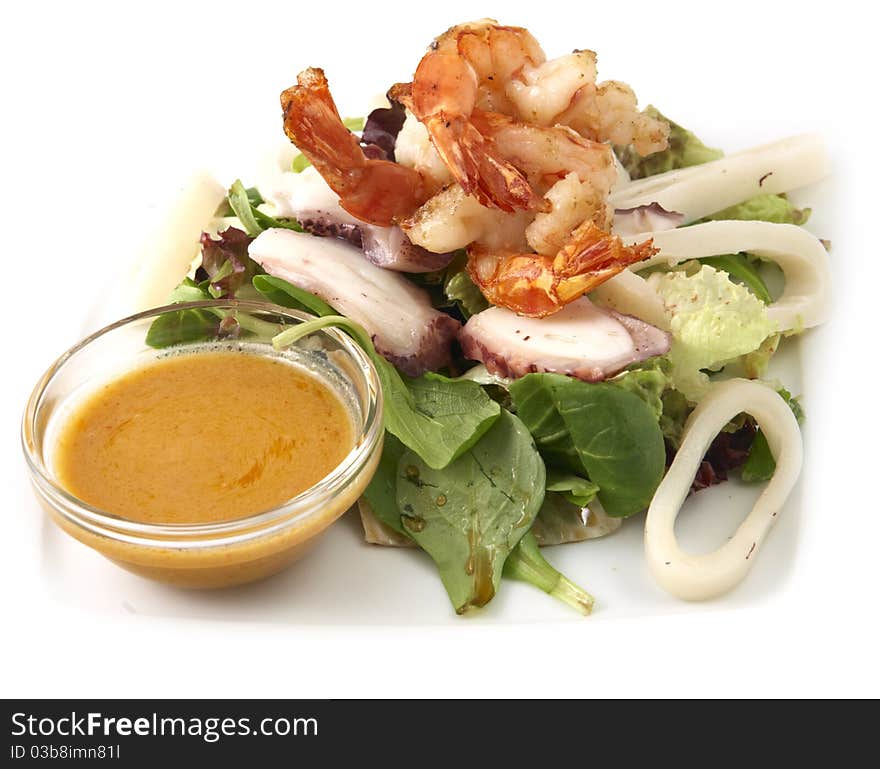 Studio photography of a seafood salad with prawns and calamary on white background