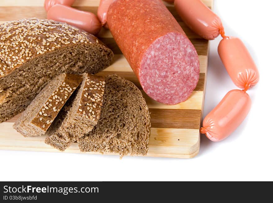 Bread and sausages on a white background